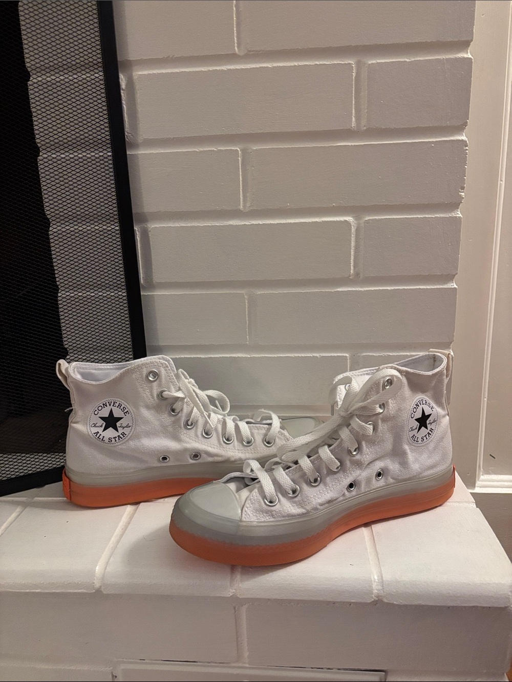 Converse Women’s White High-Top Sneakers with Orange Sole